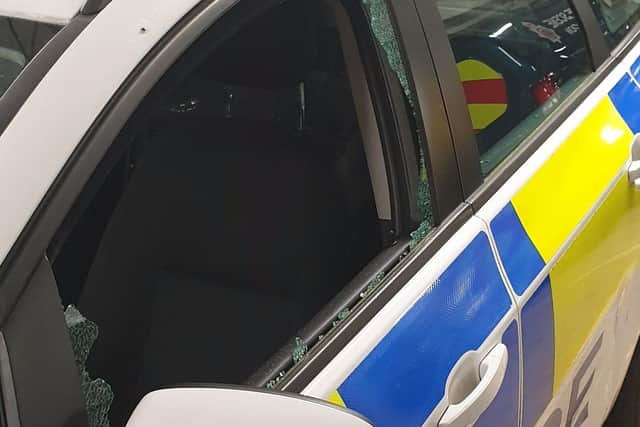 A police car was vandalised whilst officers were dealing with the double-death investigation at Meeting House Lane in Lancaster on Friday (November 13). Pic: Lancashire Police