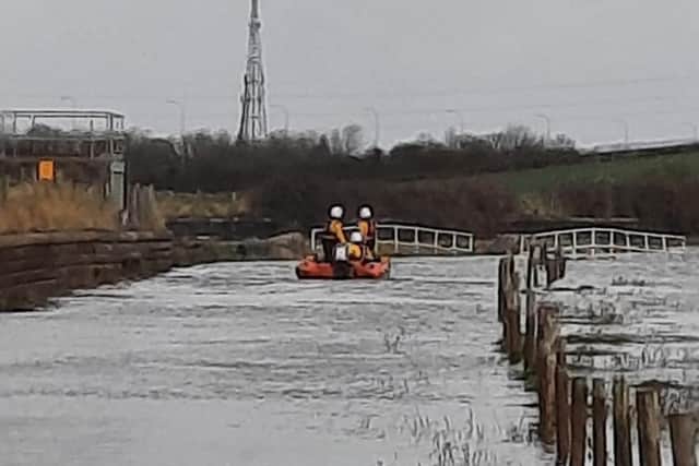 The fire service deployed two swift water rescue technicians who entered the water using a sled and brought the elderly man to safety. Firefighters also helped recover his stranded car from the flood water. Pic: Morecambe Lifeboat