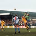 The Whitley Bay goalkeeper punches clear under pressure from Preston North End midfielder Warren Joyce in PNE's FA Cup defeat at Hillheads Park