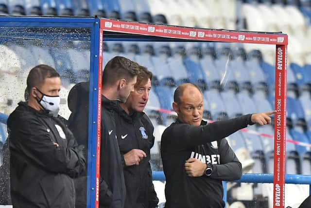 Paul Gallagher on the bench with Alex Neil and Steve Thompson