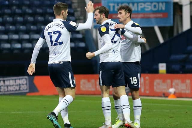 Tom Barkhuizen is congratulated by PNE team-mates Paul Gallagher and Ryan Ledson