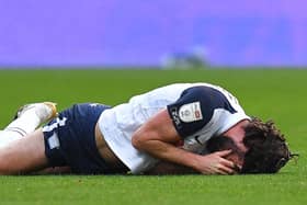 Preston North End’s Joe Rafferty lies injured