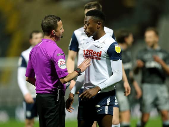 Darnell Fisher talks to referee David Webb at the final whistle of the victory over Sheffield Wednesday