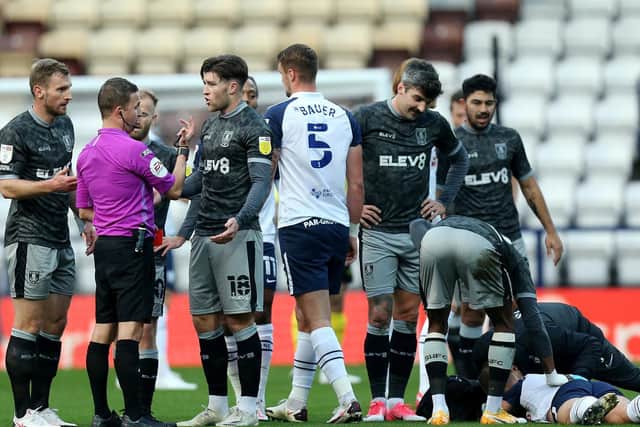 Josh Windass protests his innocence after being sent-off for a high challenge on Joe Rafferty