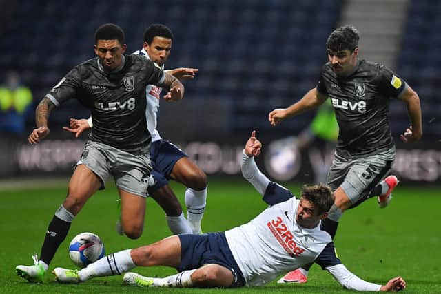 PNE midfielder Ryan Ledson makes a sliding tackle against Sheffield Wednesday