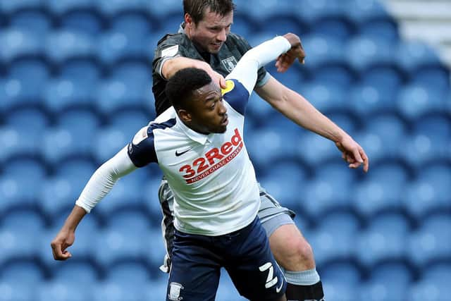 Preston North End right-back Darnell Fisher challenges Sheffield Wednesday's Julian Borner at Deepdale