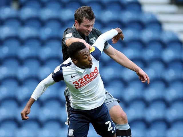 Preston North End right-back Darnell Fisher challenges Sheffield Wednesday's Julian Borner at Deepdale