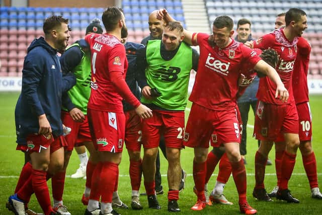Chorley celebrate victory over Wigan Athletic in the first round of the FA Cup