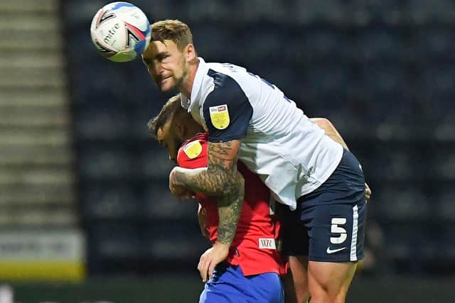 PNE defender Patrick Bauer gets his head to the ball after jumping above Adam Armstrong