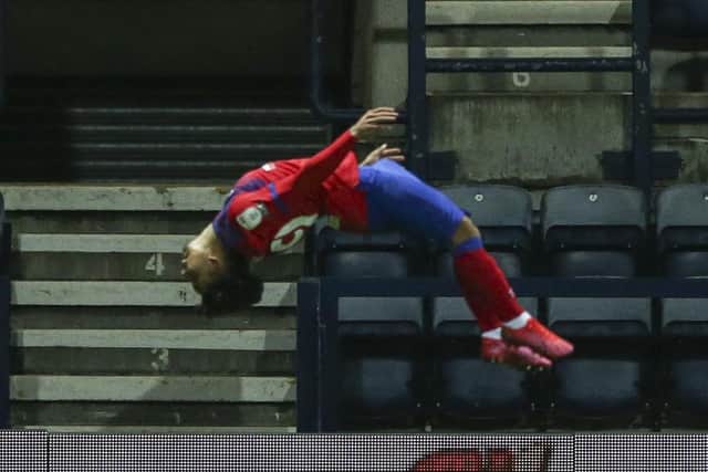 Blackburn Tyrhys Dolan does a somersault to celebrate scoring his side's third goal against PNE