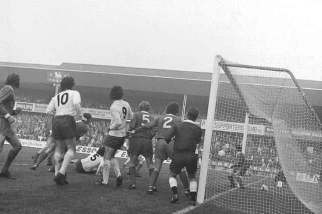 PNE's Francis Burns (No.10), Mel Holden (No.9) and John Bird (No.5) are involved in a goalmouth scramble against Cardiff