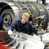 Rolls Royce staff working on fan blades for aircraft engines