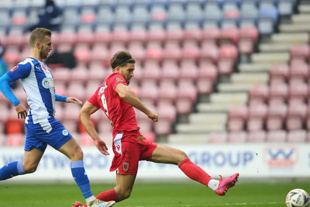 Harry Cardwell slots home against Wigan Athletic in the previous round