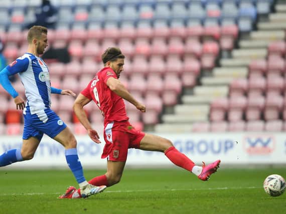 Harry Cardwell slots home against Wigan Athletic in the previous round