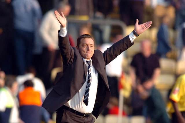 Preston manager Billy Davies shows his delight at the final whistle as his side beat Watford