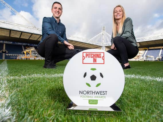 Tom Drake, Preston North End’s head of community and Harriet Creighton-Levis, assistant head of community, with the North West Football Awards prize for Community Club of the Year