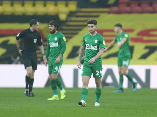 Dejected Preston players head back to the centre for kick off.