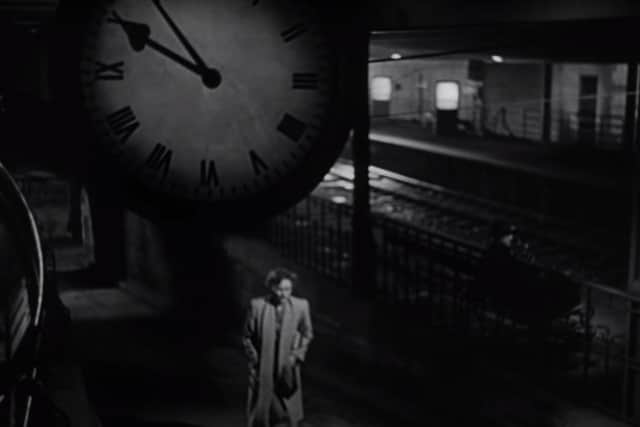 Clock on Carnforth Station in Brief Encounter with Celia Johnson (Laura) beneath it emerging from subway.