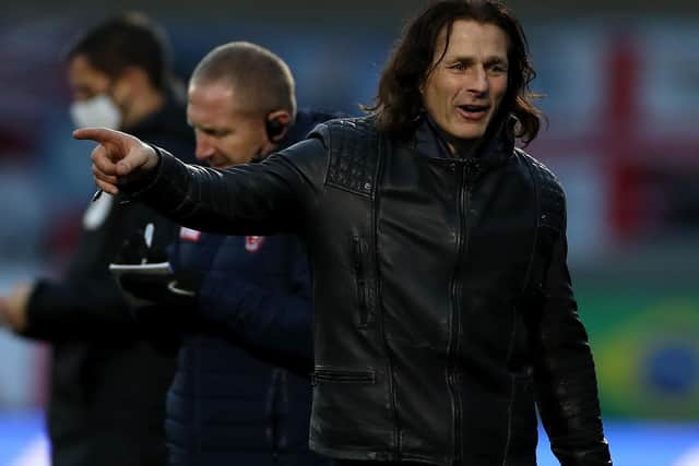 Former Preston North End winger Gareth Ainsworth is the long-serving, leather jacket-clad manager of Wycombe Wanderers