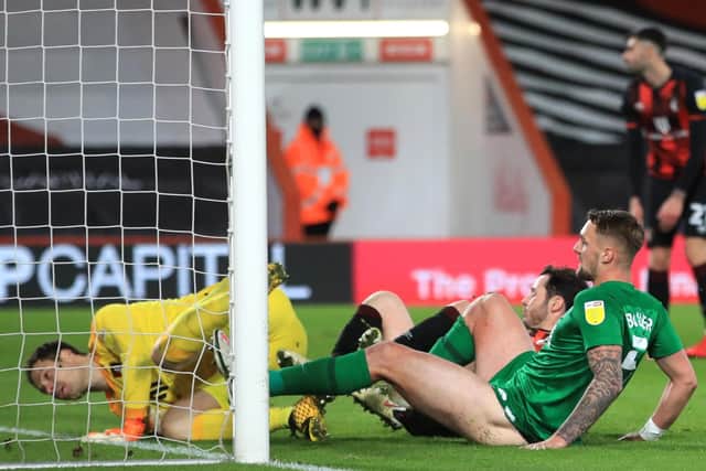 The injury to Patrick Bauer – scoring against Bournemouth on Tuesday (above) –  will offset the return of PNE’s four key men