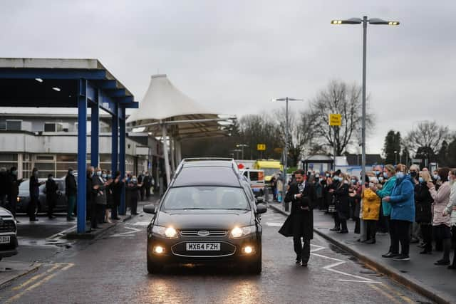 The hearse passes the main entrance of RPH