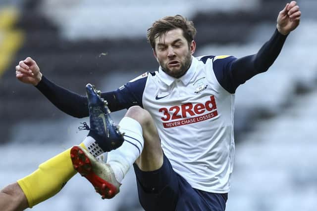 PNE's Tom Barkhuizen challenges against Wycombe