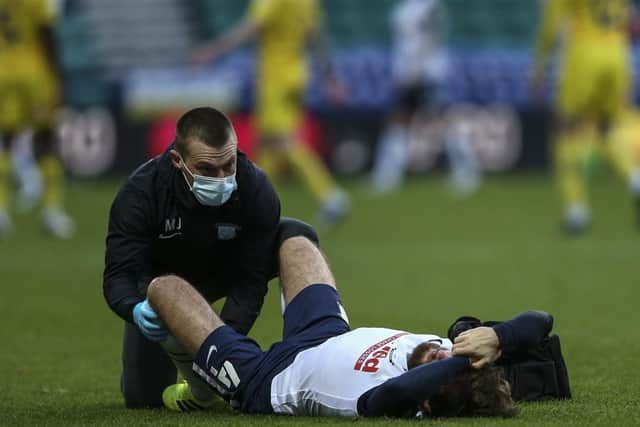 Preston North End midfielder is treated by physio Matt Jackson at Deepdale