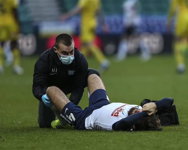 Preston North End midfielder is treated by physio Matt Jackson at Deepdale