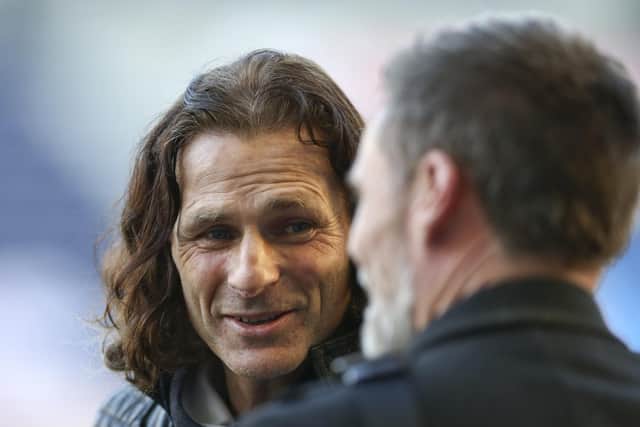 Wycombe manager Gareth Ainsworth has a chat with Graham Alexander ahead of the clash with Preston North End at Deepdale