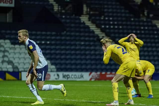 PNE striker Jayden Stockley runs to retrieve the ball from the net after Wycombe's Jason McCarthy scores an own goal