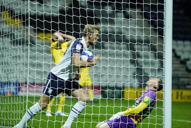 PNE striker Jayden Stockley retrieves the ball from the net after their equaliser against Wycombe