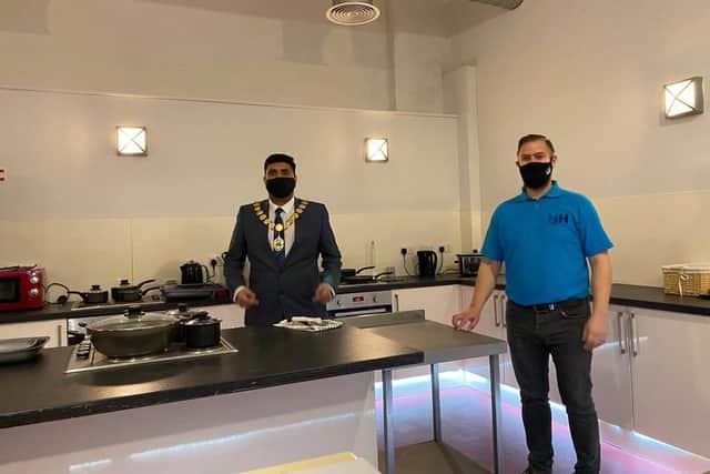 Andrew show the Mayor of Burnley Coun. Wajid Khan around the kitchen area. (picture by Helen Cottam)