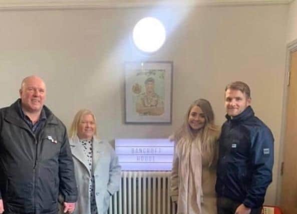 Tony and Sheila Bancroft with the portrait of their son, Jordan and Jordan's cousin, Jack and his girlfriend Georgia. (picture by Helen Cottam)