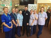 Jordan with staff at Pendleside Hospice where he is an ambassador. He has helped to raise £35,000 that will be split between the hospice and Burnley Community Kitchen.
