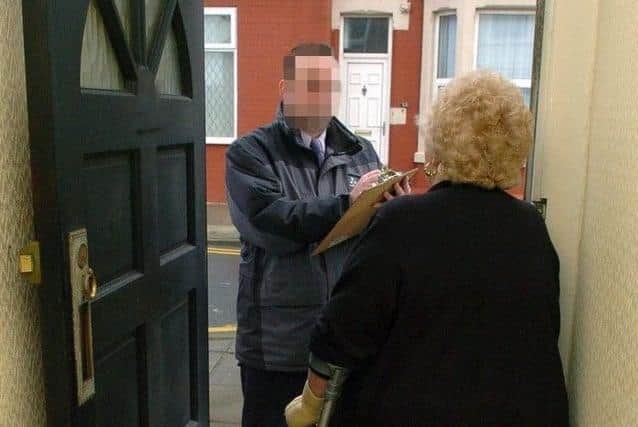 *Generic picture of a doorstep scammer. A man falsely claiming to be from EDF Energy has been visiting homes in the Leyland area and asking to take meter readings