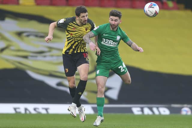 Sean Maguire challenges with Watford defender Craig Cathcart