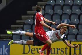 Preston North End striker Jayden Stockley takes a fall when challenged by Middlesbrough defender Paddy McNair