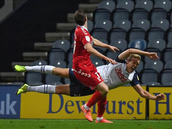Preston North End striker Jayden Stockley takes a fall when challenged by Middlesbrough defender Paddy McNair