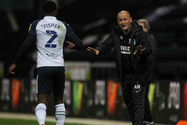 Preston North End manager Alex Neil gives instructions to Darnell Fisher during the win against Middlesbrough at Deepdale