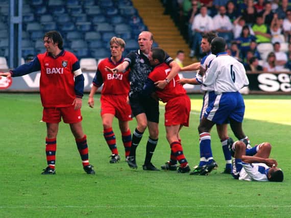Referee Steve Bennett grabs Preston North End midfielder Michael Appleton before sending him off against Luton in August 1998