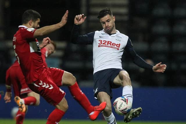 Preston North End left-back Andrew Hughes is challenged by Middlesbrough's Sam Morsy