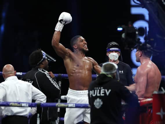 Anthony Joshua celebrates the defence of his world titles in London