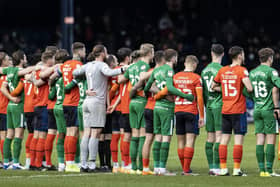 Preston North End and Luton players link arms ahead of kick-off at Kenilworth Road