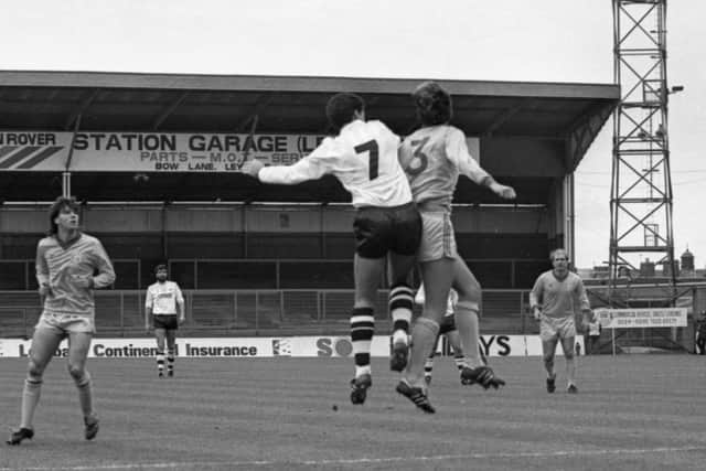 PNE winger Nigel Keen challenges in the air against Torquay