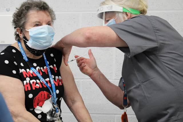 Hospital volunteer Norma (80) receiving the first Covid-19 vaccination to be administered from East Lancashire Hospitals NHS Trust