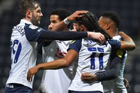 Daniel Johnson is congratulated after scoring Preston North End's winner from the penalty spot