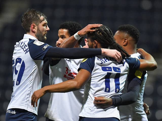 Daniel Johnson is congratulated after scoring Preston North End's winner from the penalty spot