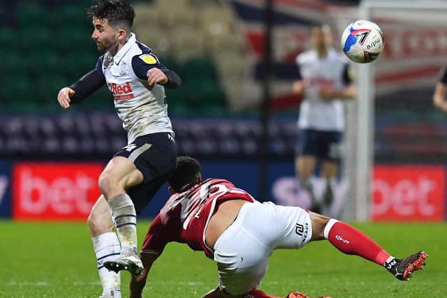 North End striker Sean Maguire tries to get away from Bristol City;s Zak Vyner