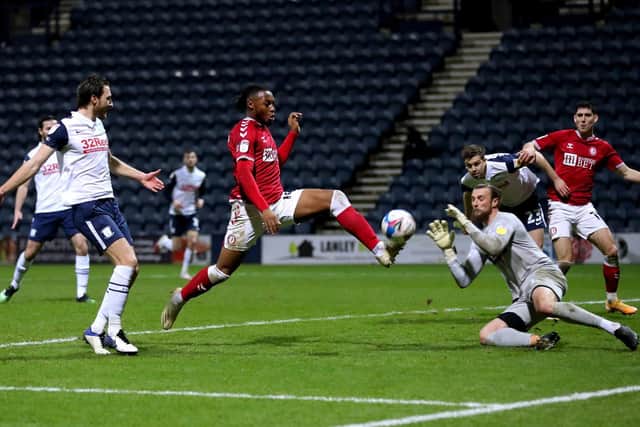 PNE goalkeeper Declan Rudd comes out to try and block Antoine Semenyo's shot