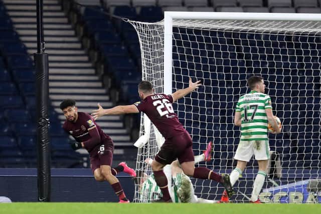 Josh Ginnelly wheels away after equalising for Hearts against Celtic at Hampden Park